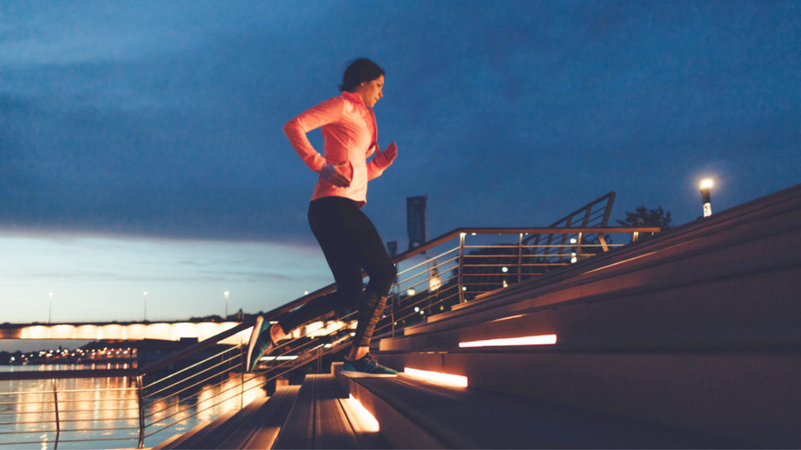 woman running up stairs