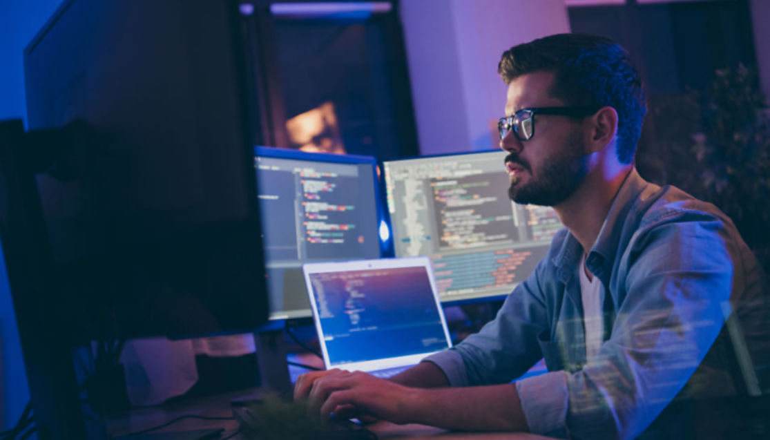 man working at laptop